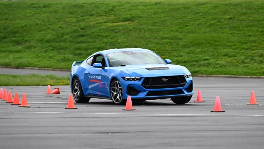 A blue Ford Mustang on the Urban X course.